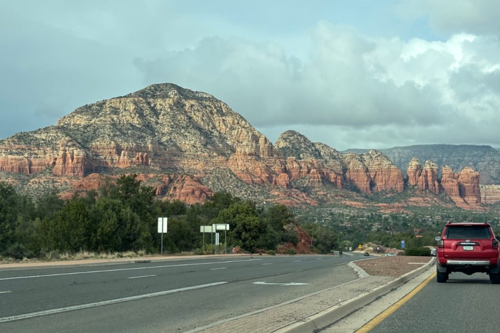 Red rock formations taken from inside a car approaching Sedona, Arizona