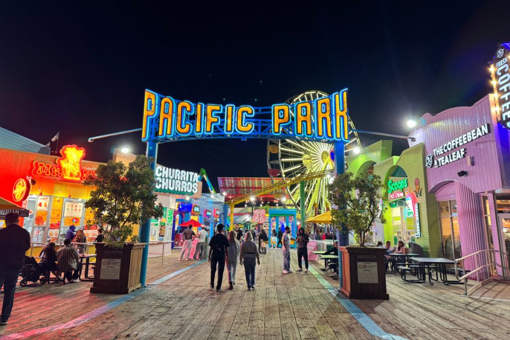 Illuminated sign on Santa Monica pier reading "Pacific Park"